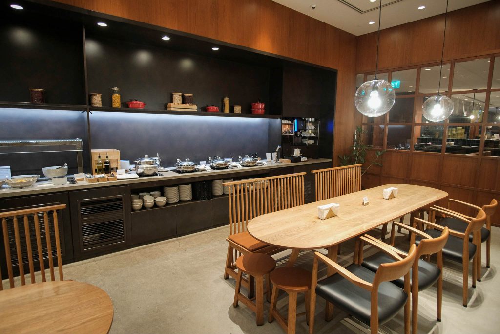 Long table for dining in front of the buffet counters.