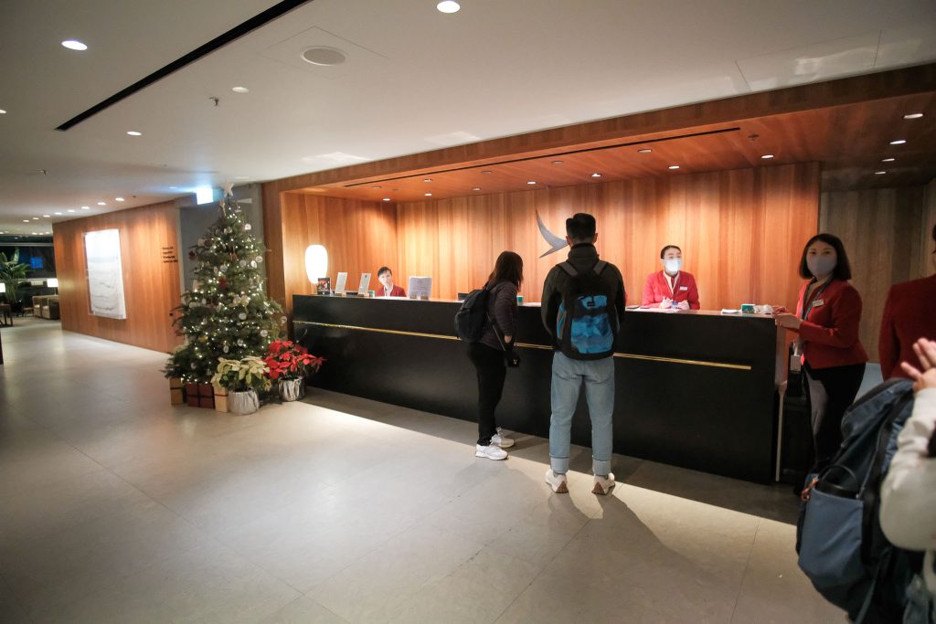 Check in to The Pier Business Class Lounge at Hong Kong International Airport.