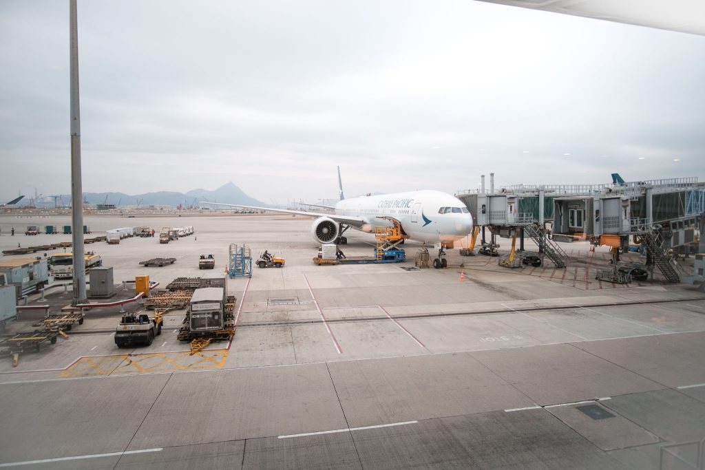Cathay Pacific plane docked by the air bridge.
