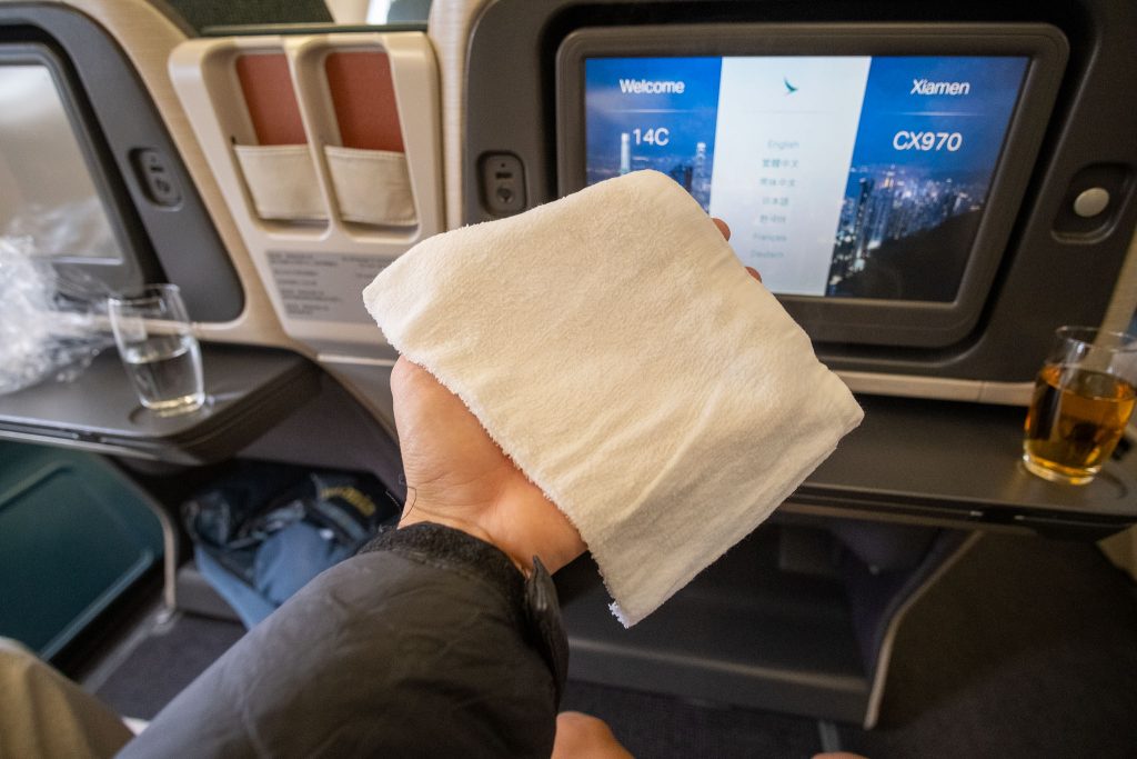 The cabin crew served us hot towels shortly after boarding.